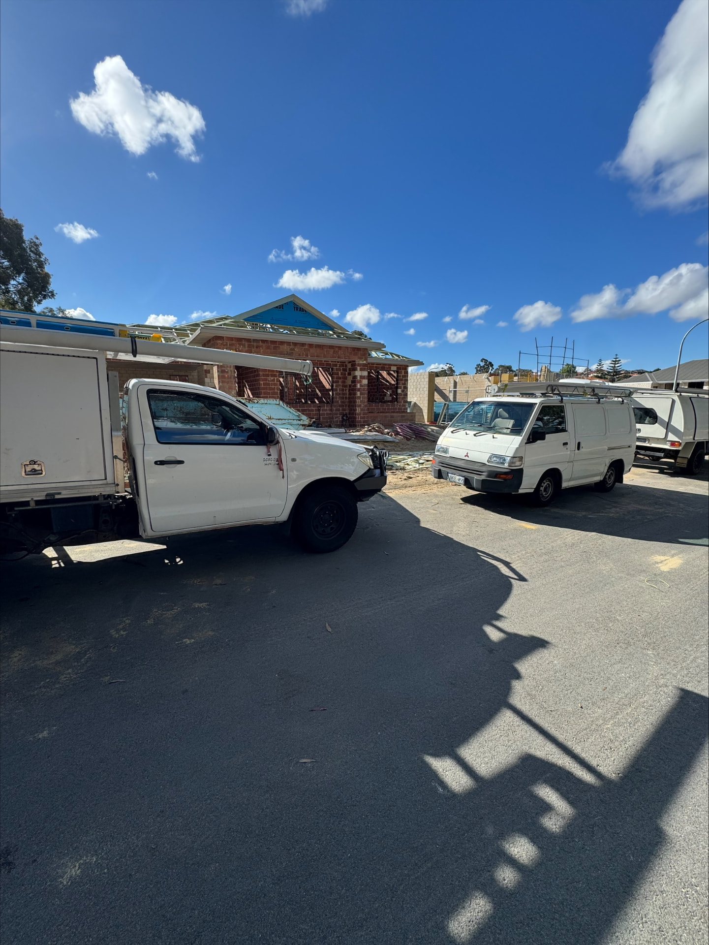 McGuires Electrical work vehicles on site at a new home build in the Glen Iris estate, Jandakot