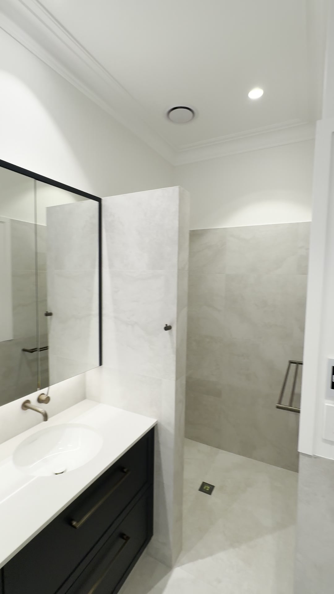 Walk-in shower area with downlighting and new power points in a Nedlands bathroom renovation