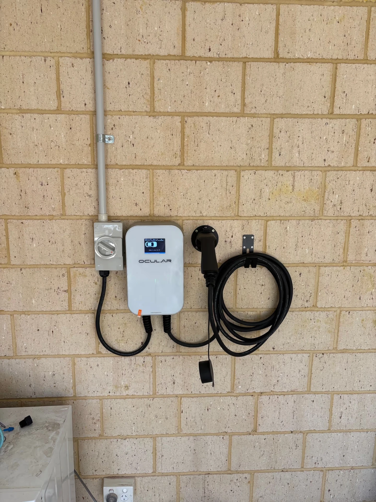 Ocular IQ EV wallbox installed in a Perth garage with dedicated circuit and isolator by McGuires Electrical