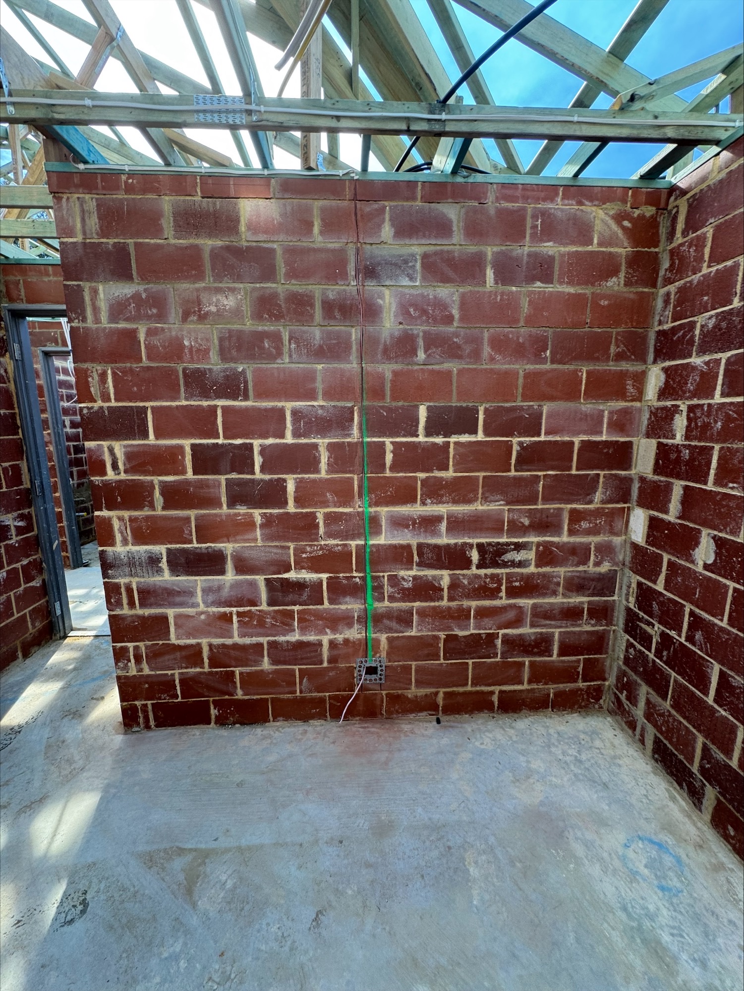 Chased cable run to a power point position in a brick wall at a Glen Iris new build, Jandakot