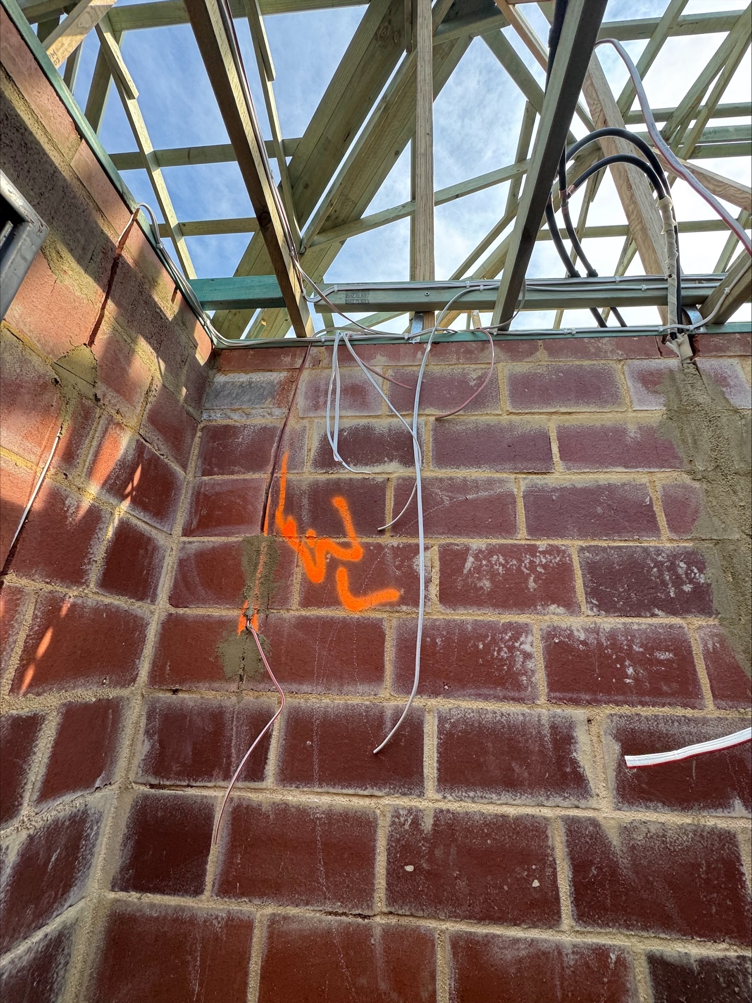 Cable drops and roof framing during the electrical rough-in of a new home in Jandakot