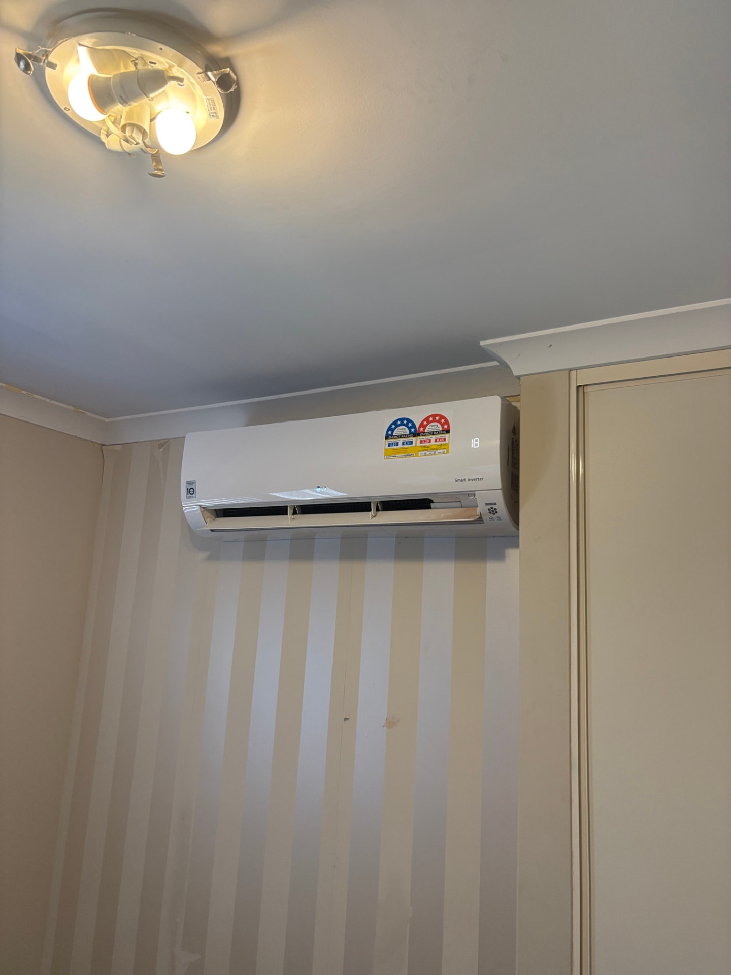 Smart inverter split-system indoor unit installed in a bedroom in Perth's southern suburbs
