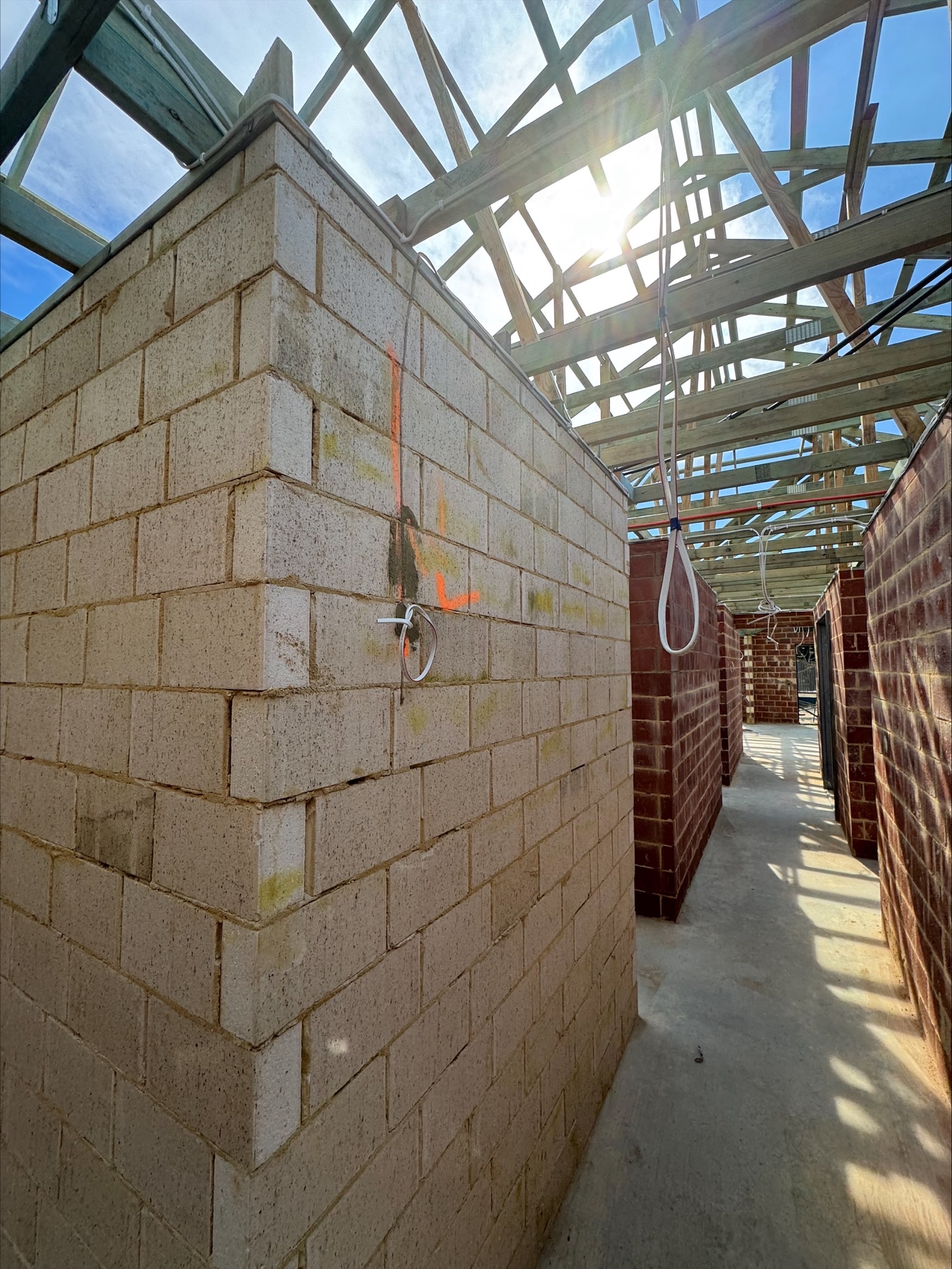 Cabling roughed in along a corridor of a new double-brick home at Glen Iris, Jandakot